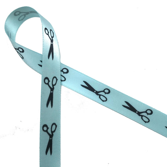 Scissors in black silhouette printed on 5/8" lt. blue  single face satin ribbon is an ideal way to tie gifts and favors for your hair stylists or sewing skilled friends!