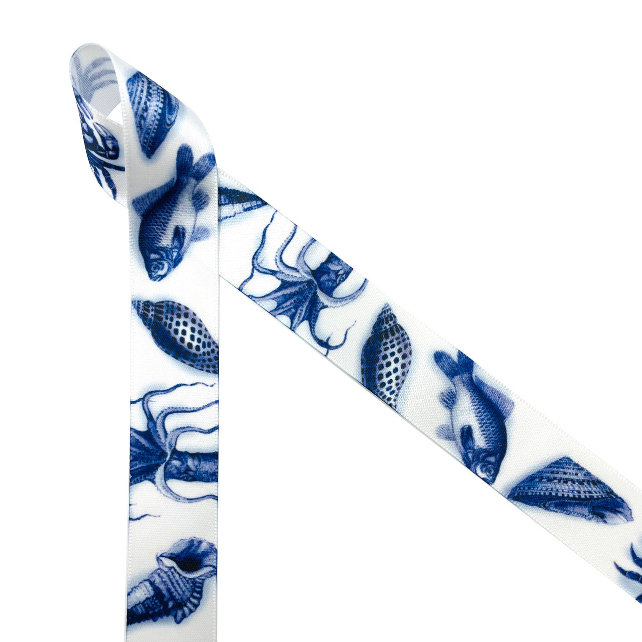  Vintage sea creatures inspire the imagination! Vintage sea creatures in navy blue featuring conch shells, clam shells, fish and octopi printed on 7/8" white single face satin are a wonderful addition to any Nautical or seafaring themed party. This is a great ribbon for Father's Day, bachelor parties, beach themed parties, gift wrap, party decor, party favors, cookies, cake pops and dessert tables. Use this ribbon for ocean themed crafts, sewing and quilting projects too. All our ribbon is designed and prin