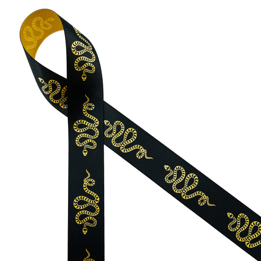  Snakes are a symbol of good fortune and creative force. Gold snakes slither along a black background printed on 7/8" dijon gold single face satin ribbon. This is an ideal ribbon for Halloween parties, mystical events, Goth designs and Gothic themed events. Use this ribbon for fascinators, costuming, sewing and quilting projects. This is an ideal ribbon for gift wrap, gift baskets, party favors and party decor. All our ribbon is designed and printed in the USA