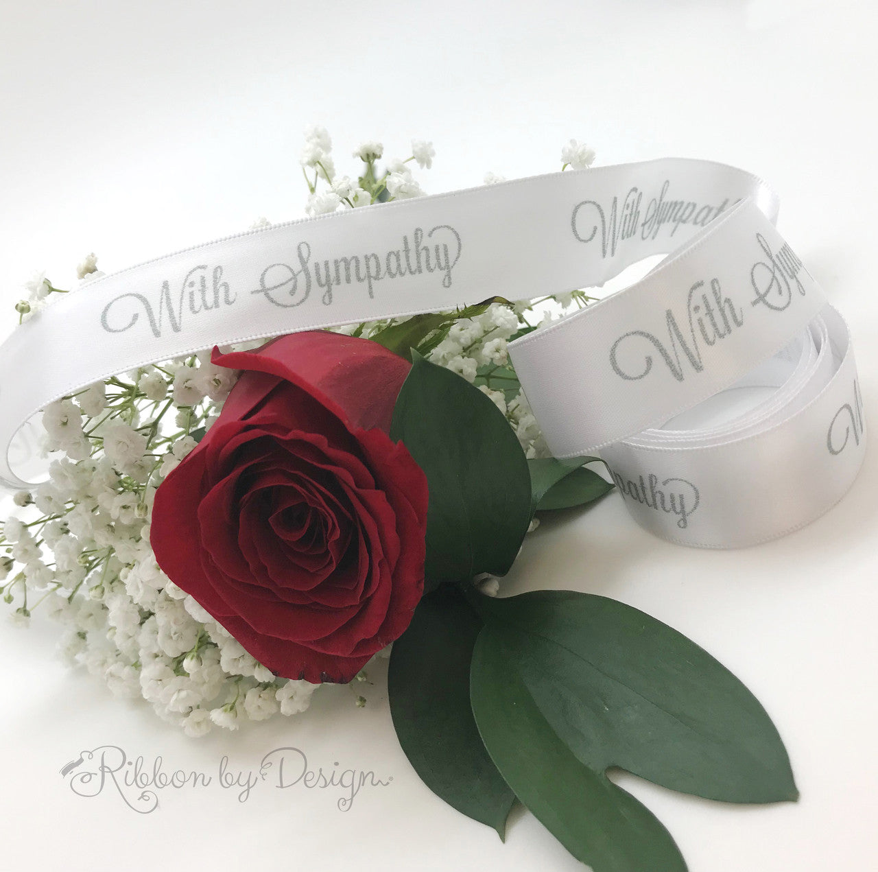 Adding our simple message to a single bloom or a sympathy arrangement makes the perfect statement.