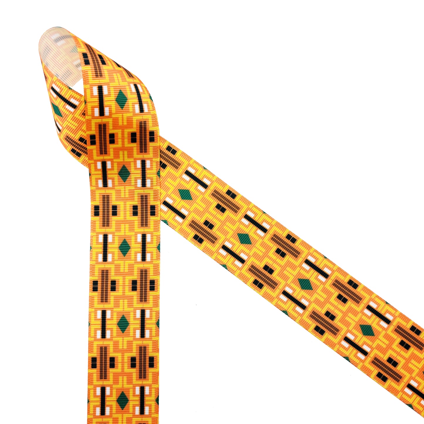 Aztec Design ribbon printed in three color ways of orange, black and cream printed on 1.5" white grosgrain