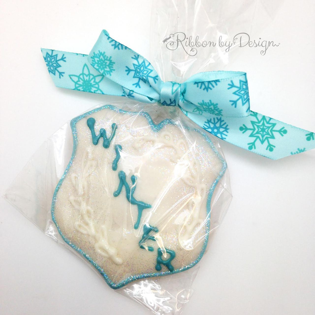 Pretty little Winter cookie looks even sweeter tied with our blue snowflake ribbon!