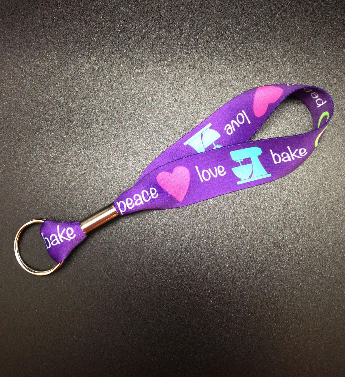 Peace, Love, Bake Key Fob in purple, pink, teal and lime on 1" Webbing