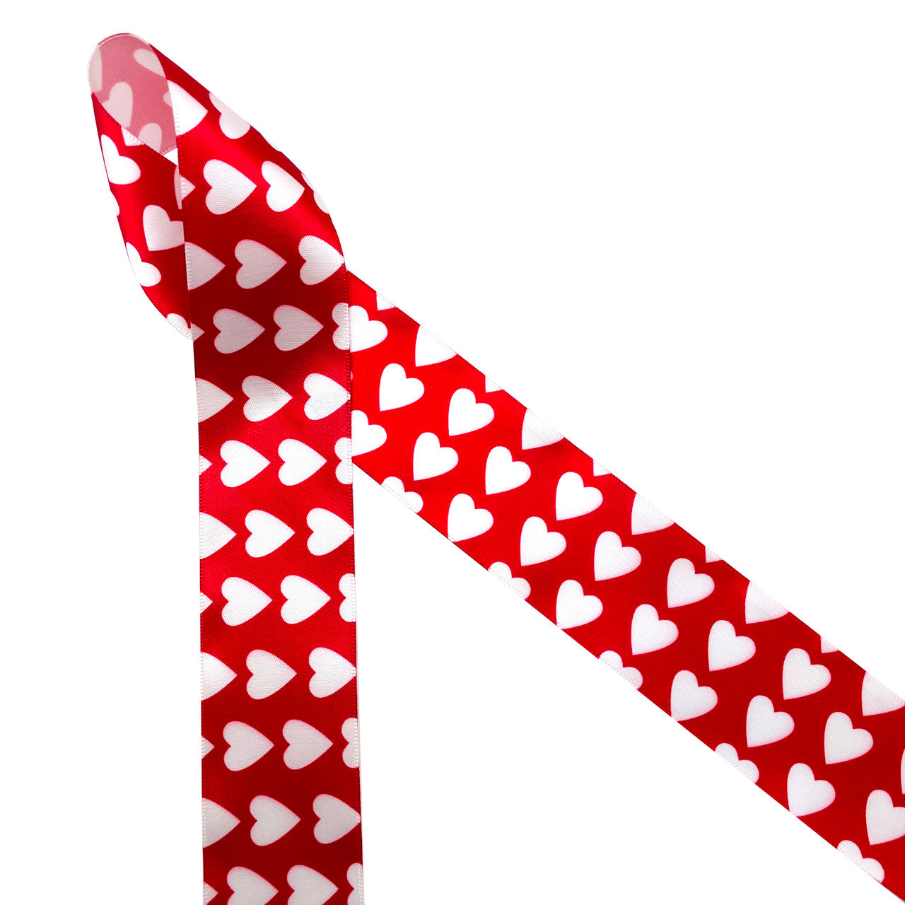 White hearts on a red background printed on 1.5" white single face satin ribbon is a Valentine classic!  The width of this ribbon lends itself to gift wrapping, gift baskets, Valentine party decor, sweets tables, candy shops and chocolatiers! This is also a great ribbon for Valentine crafts including wreaths, sewing and quilting projects! All our ribbon is designed and printed in the USA