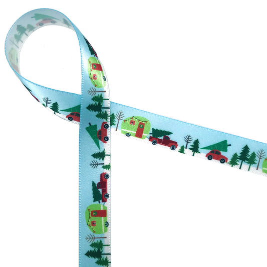 Bringing home the tree featuring a little red pick up truck with a tree in the bed towing a Christmas camper! Printed on a blue background on 5/8"white single face satin, this ribbon will be the hit of the season!