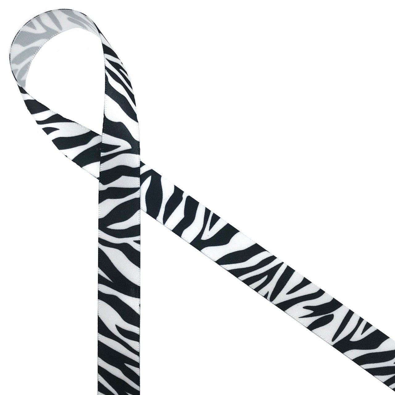 Zebra stripes in black on 5/8" white single face satin appeals to the wild side of life! Be sure to add this ribbon to baby shower gifts, craft projects and favors.