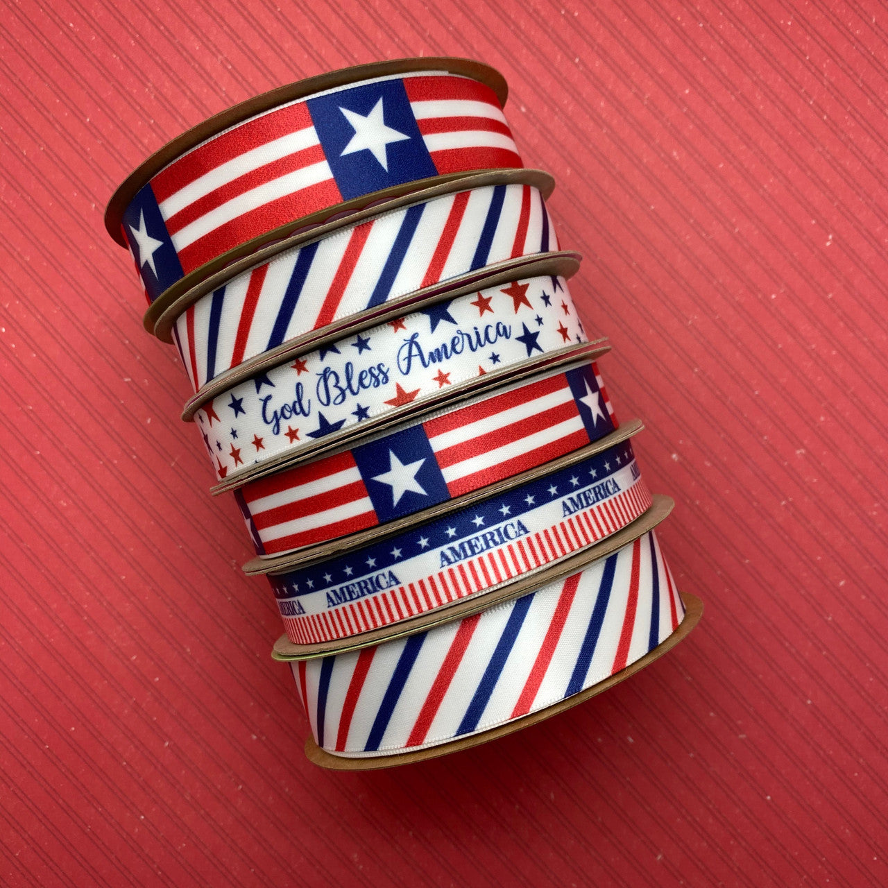 God Bless America ribbon with stars of blue and red printed on 5/8" white single face satin