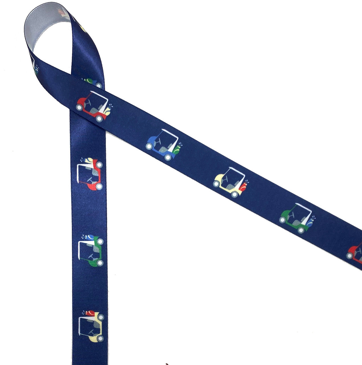 Golf carts in red, yellow, blue and green on a navy background printed ...